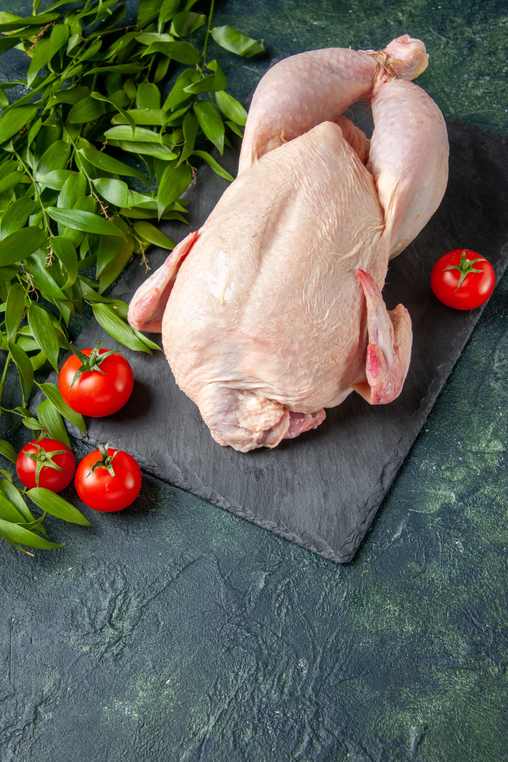 top view fresh raw chicken with red tomatoes dark background chicken meal animal meat photo food color kitchen